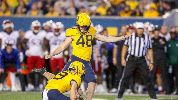 Sep 10, 2022; Morgantown, West Virginia, USA; West Virginia Mountaineers place kicker Casey Legg (48) kicks a field goal during the fourth quarter against the Kansas Jayhawks at Mountaineer Field at Milan Puskar Stadium.